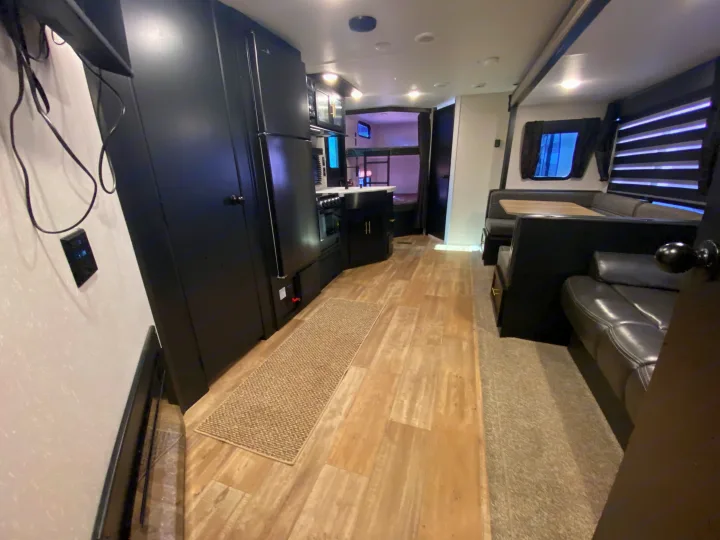 Step inside this modern RV rental with a full kitchen, comfortable dinette, and cozy bunk beds. Ideal travel trailer layout.. Forest River Cherokee 2021