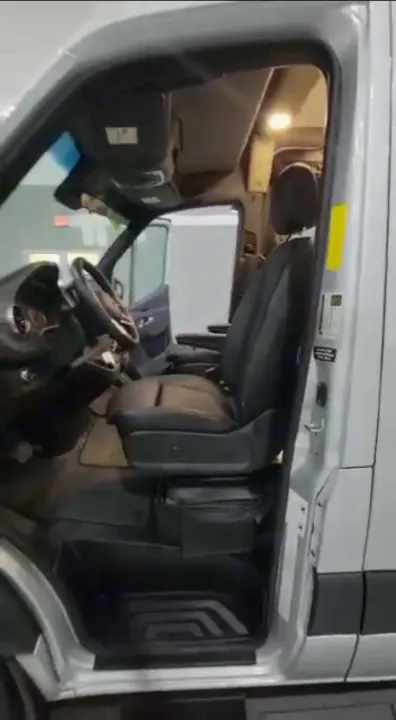 RV rental van's front interior. View shows driver and passenger seats, steering wheel, and dashboard.. Cahaba Cahaba Class B 2022