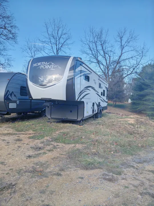 Spacious North Point fifth-wheel RV rental & travel trailer parked outdoors. Ready for adventure!. Jayco North Point 2021