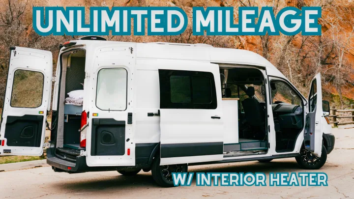 RV rental: White camper van w/ open doors showcasing its spacious interior, bed, & kitchen. Unlimited mileage & heater.. Ford Transit 250 RWD 2018