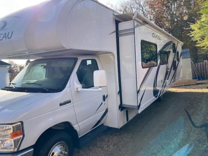This white Class C RV rental, with its slide-out extended, is ready for your next road trip adventure.. Thor Chateau Victory 2022
