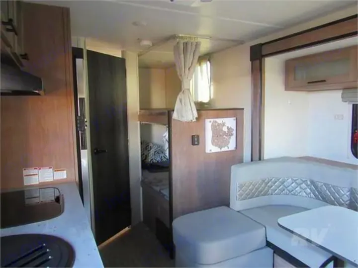 This RV rental's interior features a compact kitchen, U-shaped dinette, and. Forest River No Boundaries 19.8 2021