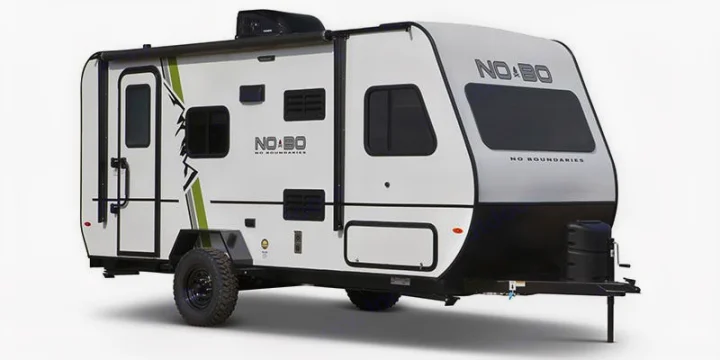 A white 'No Boundaries' travel trailer for RV rental. Rugged design, off-road ready with an awning and. Forest River No Boundaries 19.8 2021