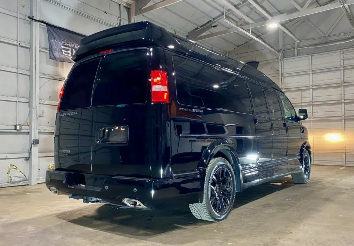 Explore in style! This glossy black high-top Chevrolet Express Explorer conversion van, ideal for an RV rental, is ready for your next journey.. Passenger Van 9 Passenger Van 2024