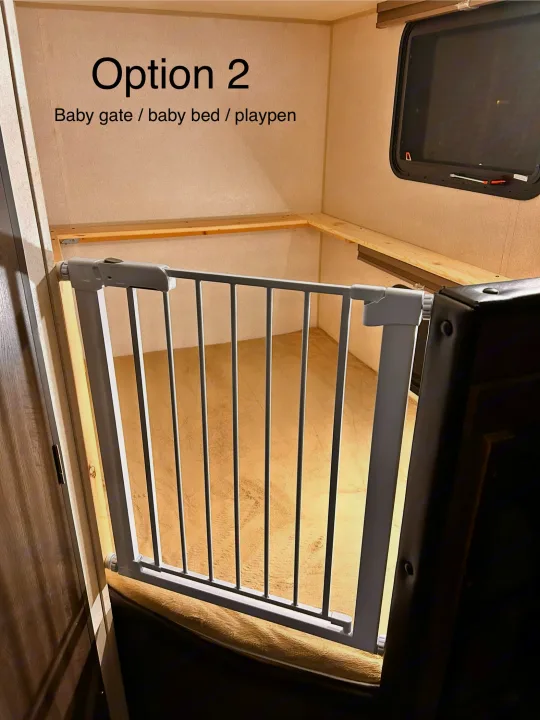 RV rental bunk area with baby gate for child safety: a perfect playpen or bed space for families on the go.. Forest River Wildwood X-Lite 2019