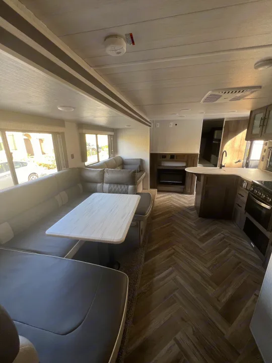 Spacious RV rental interior: living, dining, and kitchen areas with modern decor.. Forest River Salem Cruise Lite 2022