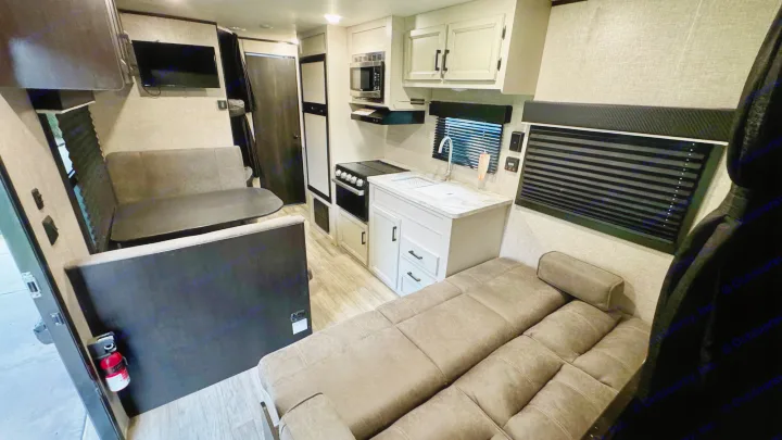 Tour this rv rental: featuring a well-equipped kitchen, cozy dinette, and versatile sofa bed in a bright interior.. Jayco Jay Flight SLX 2022