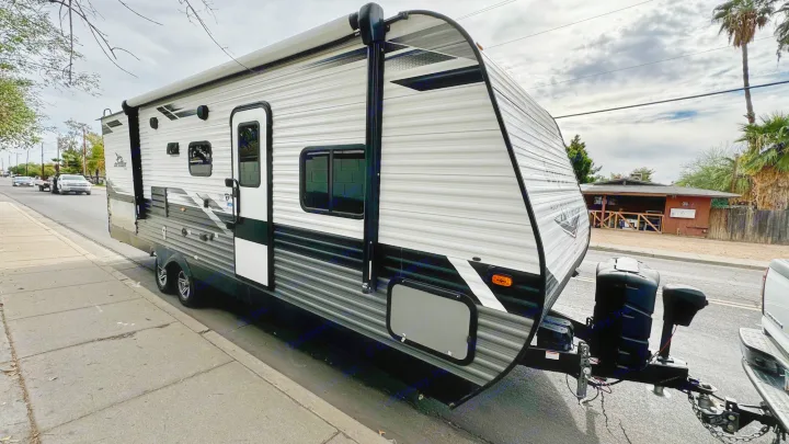 Jayco travel trailer (RV) on the street, ready for your next rv rental journey.. Jayco Jay Flight SLX Rocky Mountain Edition 2022