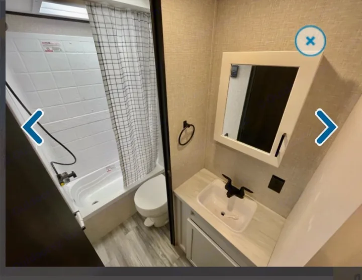 RV rental bathroom featuring a compact tub/shower, toilet, and sink vanity. A clean and functional space.. Jayco Jay flight 2024