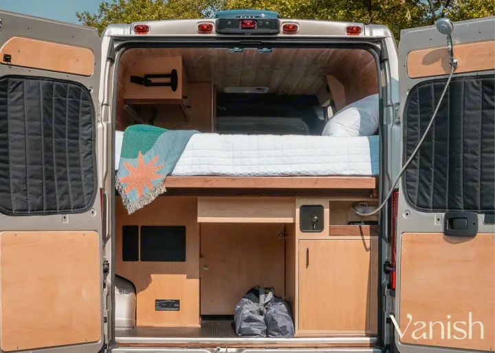 Custom RV rental interior: cozy bed, shower, & kitchen in a spacious camper van. Perfect for adventures!. Ram Promaster 2021