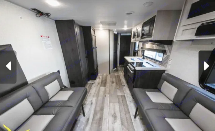 RV rental interior: modern kitchen, comfortable seating, and wood-look flooring. Perfect for your next adventure.. Sportsmen by KZ 250THLE 2022