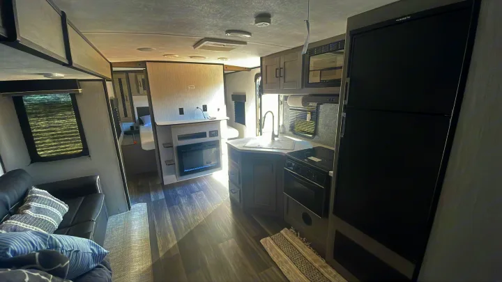 Modern RV rental interior: Spacious kitchen, living area, and bedroom for comfortable travel.. Heartland RVs Mallard 2021