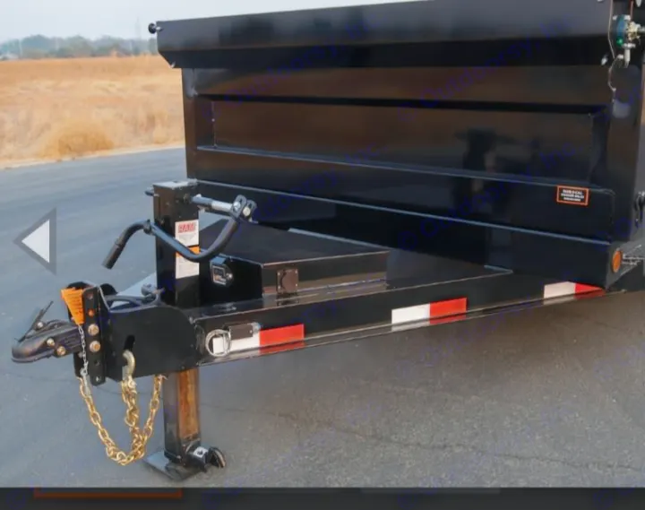 Heavy-duty black dump trailer with robust hitch, jack, and tool storage. Versatile for hauling, great for RV rental sites.. Iron Bull 7x14 Dump Trailer 2022