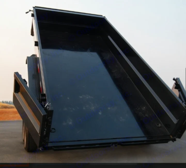 Heavy-duty black dump trailer with bed raised, ideal for debris removal. Explore our other rental options, including rv rental.. Iron Bull 7x14 Dump Trailer 2022