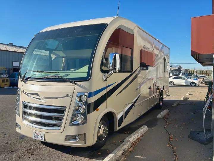 A beige Vegas model rv rental motorhome parked on a sunny day, ready for your next adventure.. Thor Motor Coach Vegas 2018