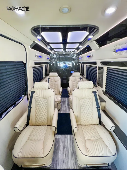 Step inside this luxury RV rental, featuring plush cream leather seats, custom lighting, and privacy blinds for a comfortable Voyage.. Mercedes-Benz Sprinter 419 LWB High Roof 2024