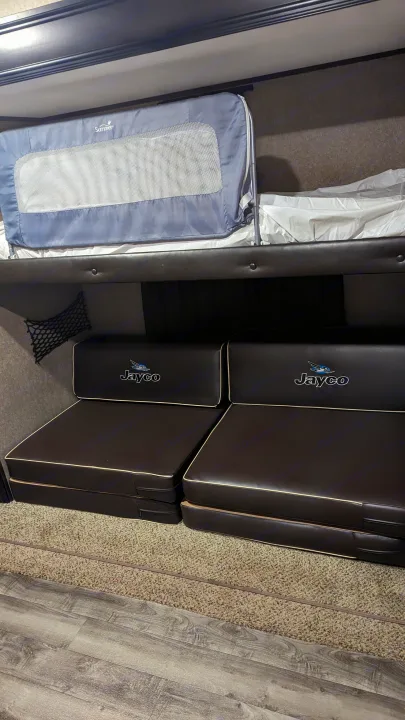 RV rental: bunk bed w/ baby safety rail & comfortable Jayco sofa/seating area below.. Jayco Jay Flight 2018
