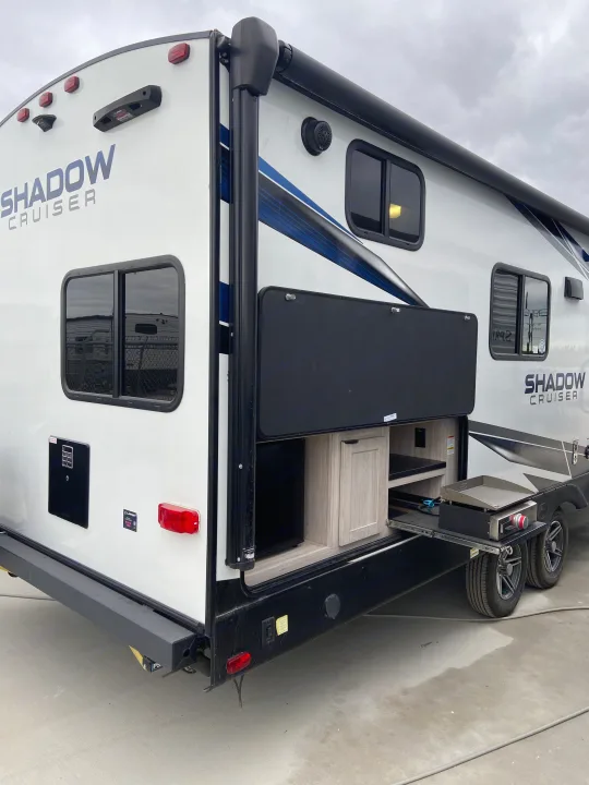 Travel trailer RV rental featuring a convenient outdoor kitchen and grill setup, perfect for your next adventure.. Cruiser RV Shadow Cruiser 2022