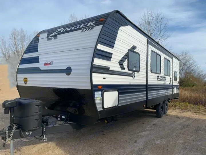 Looking for an RV rental? This Zinger Lite travel trailer offers a modern design with black & white exterior, perfect for your next trip.. Crossroads Zinger 2022