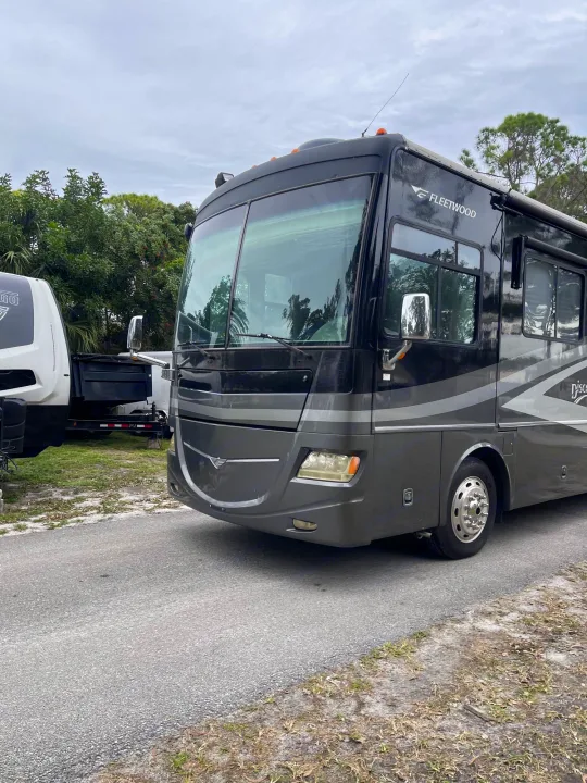 Spacious Fleetwood Discovery RV rental parked roadside. Perfect for your next outdoor adventure.. Thor Mandalay 2006