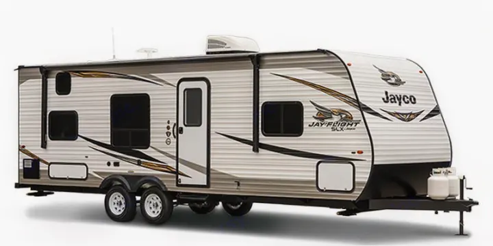 Modern Jayco travel trailer, ideal for an RV rental. This spacious camper has multiple windows, a side door, and front propane tanks.. Jayco Jay Flight SLX 2019