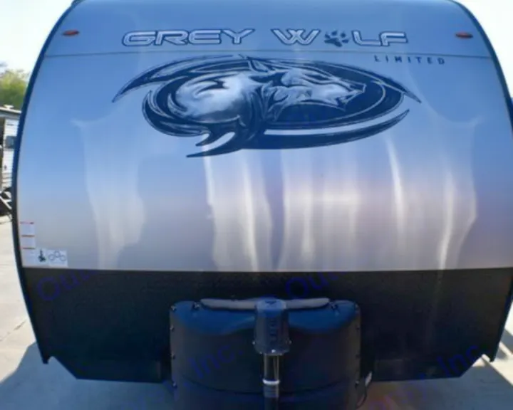 Front of a silver Grey Wolf travel trailer. This stylish RV rental is equipped for memorable camping adventures.. Forest River Cherokee Grey Wolf 2023