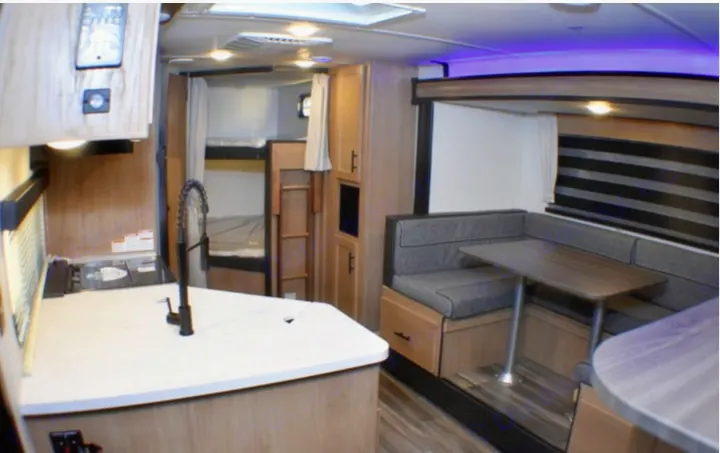 Step inside this rv rental: featuring a bright kitchen, cozy dinette, and convenient bunk beds perfect for family adventures.. Forest River Cherokee Grey Wolf 2023