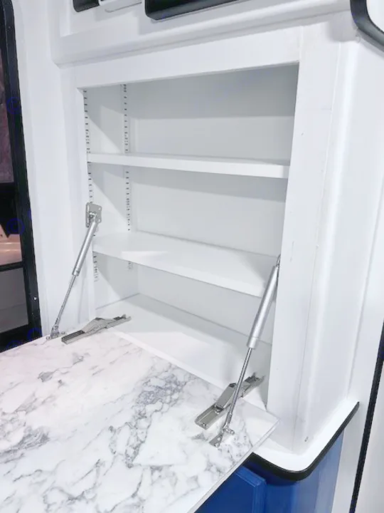RV rental features a clever pull-down marble-look counter and adjustable shelving for efficient use of space.. Winnie Drop Winnie Drop Trailer 2017