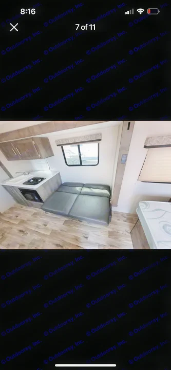 RV rental interior: kitchenette with sink, stove, microwave, & convertible sofa bed for compact living.. KZ Escape 2019