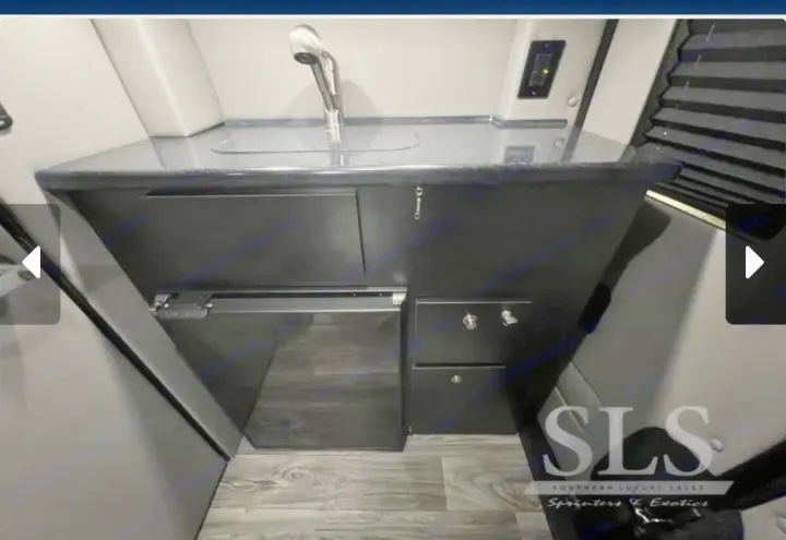 Luxury RV rental van conversion interior: modern kitchenette with sink, integrated fridge, and sleek cabinetry.. Midwest Automotive Designs Day Cruiser 2024