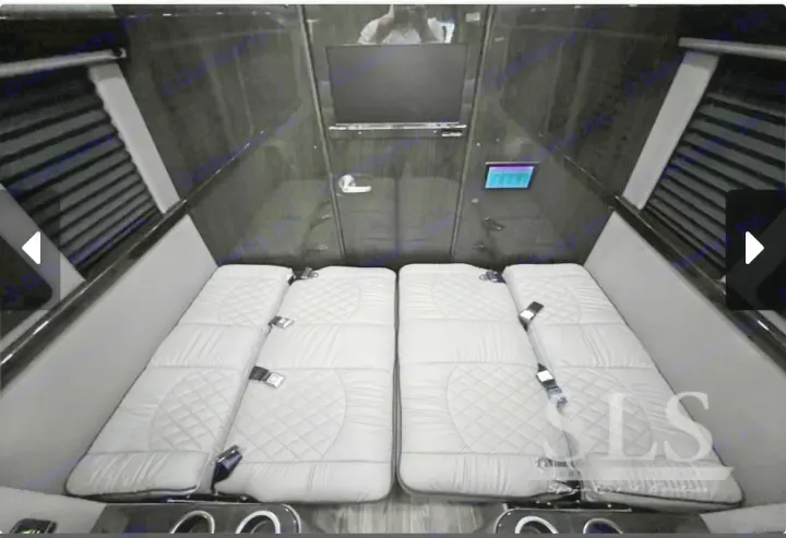 Luxury van RV rental interior: plush quilted beds/seats, TV, and control panel offer ultimate comfort for travel.. Midwest Automotive Designs Day Cruiser 2024
