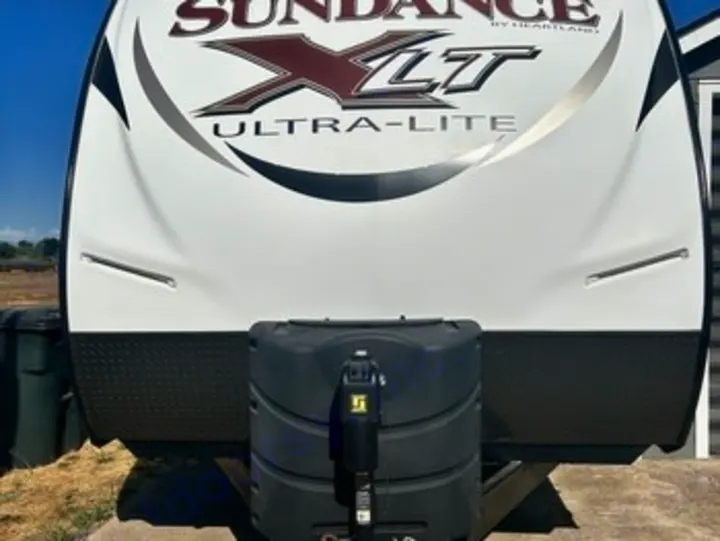 Front view of a white. Heartland RVs Sundance XLT 2016