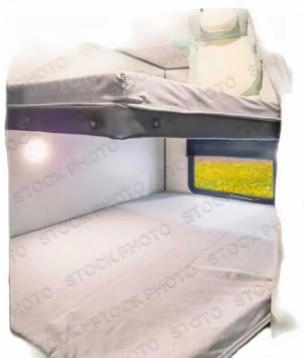 Inside an RV rental, showing cozy bunk beds with light bedding. A window offers a scenic view of green and yellow fields.. Forest River ASPEN TRAIL 2024