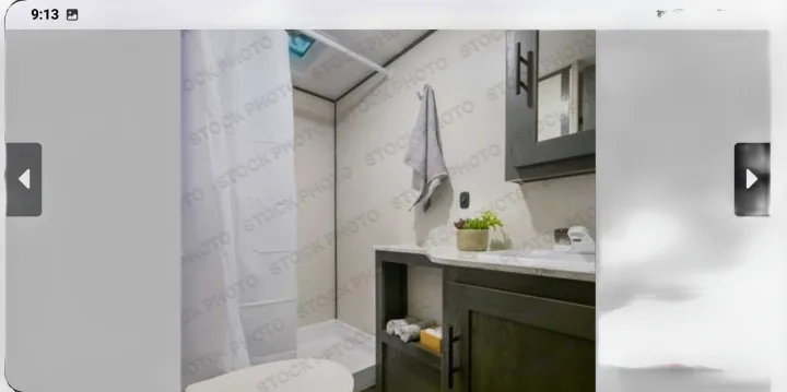 Step inside this modern RV rental bathroom, featuring a clean shower, sink, and vanity.. Forest River ASPEN TRAIL 2024