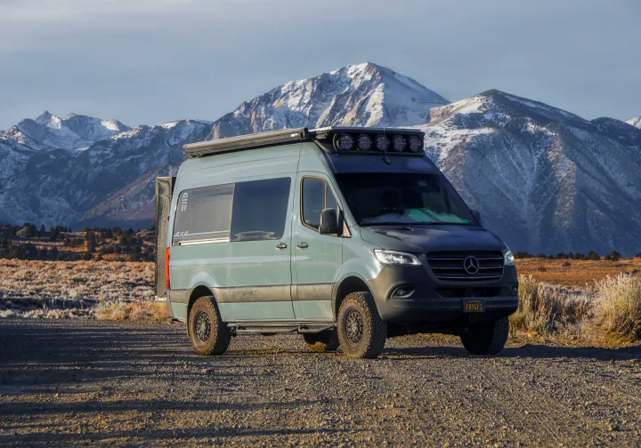 Custom 4x4 Mercedes Sprinter camper van RV rental, parked on a dirt road with majestic snowy mountains.. Mercedes-Benz Sprinter RV Motorhome Campervan 2020