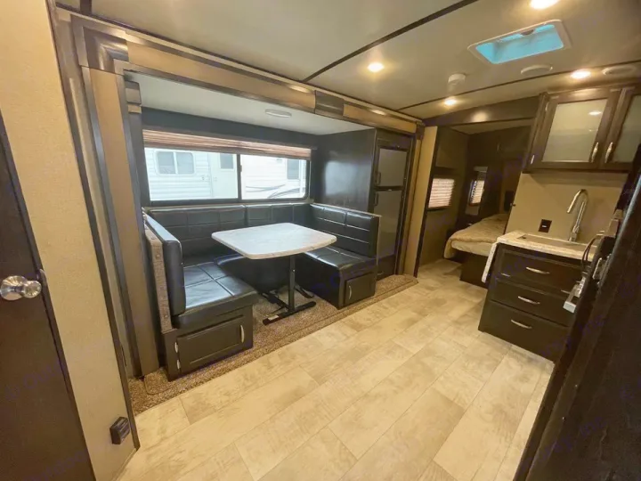 Spacious RV rental interior featuring a comfortable dinette, functional kitchen, and cozy bedroom area.. Grand Design Other 2018