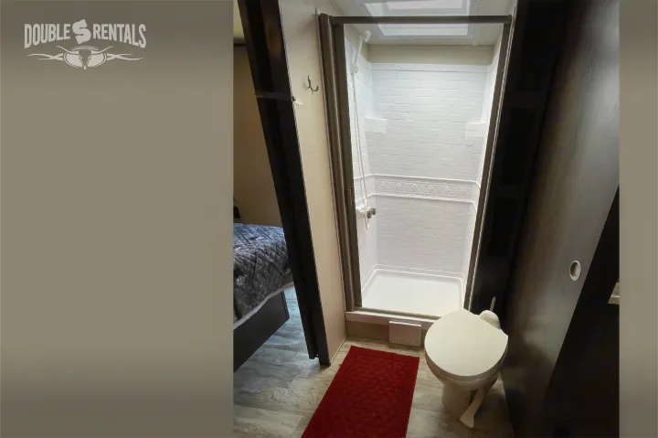 RV rental: Compact bathroom with shower and toilet, next to the sleeping area.. Grand Design Transcend 2022
