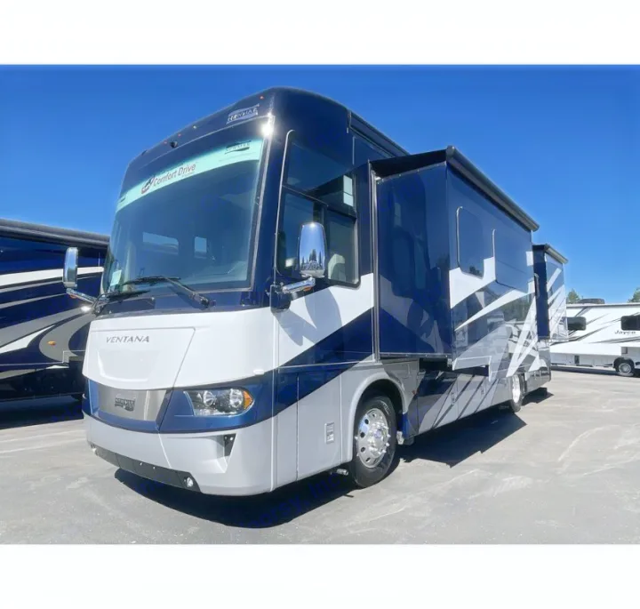 A sleek dark blue & white luxury motorhome, with slides out, perfect for your next rv rental adventure. Travel in comfort!. Newmar Ventana 2023