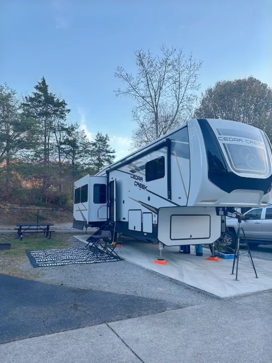 This large Cedar Creek fifth wheel rv rental is perfectly set up at a scenic campsite with outdoor amenities, ready for fun.. Cedar Creek Cedar Creek Fifth Wheel 2022