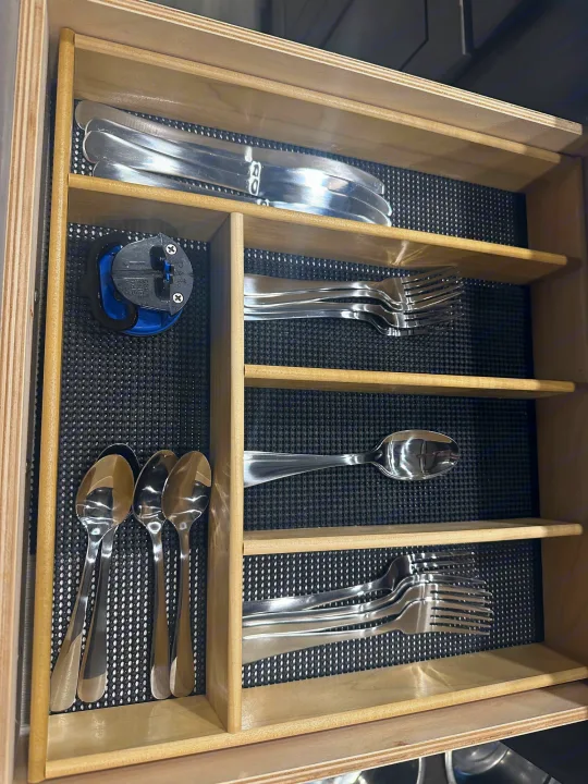 Well-organized silverware and device in an RV rental kitchen drawer. Includes knives, forks, & spoons.. Cedar Creek Cedar Creek Fifth Wheel 2022