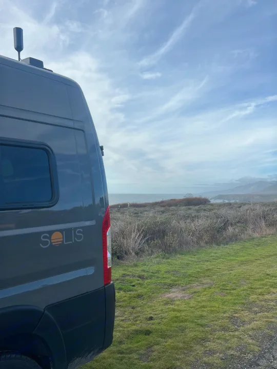 Solis RV rental, equipped with a rooftop antenna, parked for stunning ocean views.. Winnebago Solis BUT59P 2024