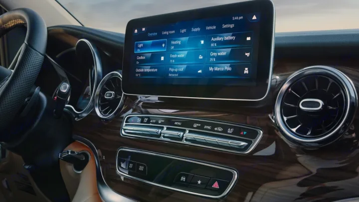 Experience a modern RV rental! This camper van's dashboard features an infotainment screen controlling lighting, water, heating, and a pop-up roof.. Mercedes Marco Polo Class V 2019