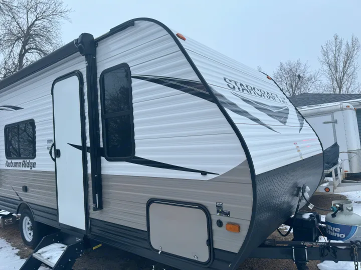 This travel trailer RV rental, an Autumn Ridge by Starcraft, is ready for adventure, even with snow on the ground.. Starcraft Autumn Ridge Outfitter 2020