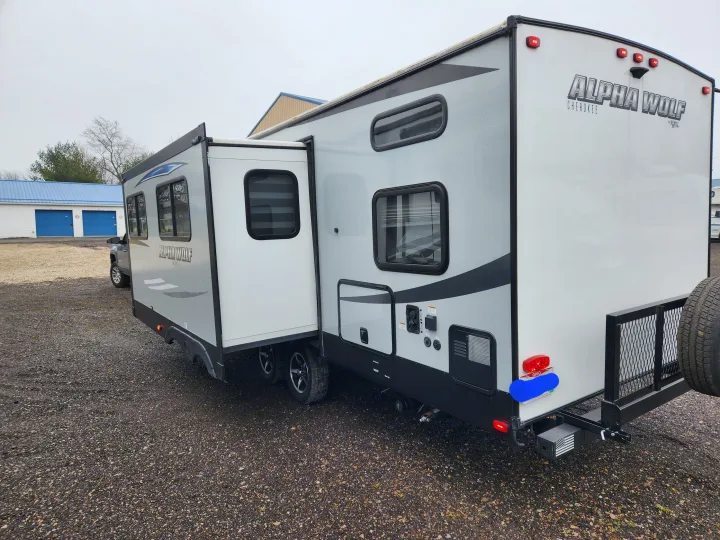 Grey Alpha Wolf travel trailer with extended slide-out, perfect for your next rv rental adventure.. Forest River Cherokee Alpha Wolf 2020