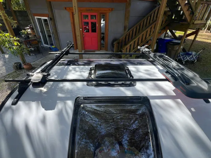 White RV roof with two skylights and a black Yakima roof rack. Great for your next rv rental adventure!. nuCamp T@G 2023