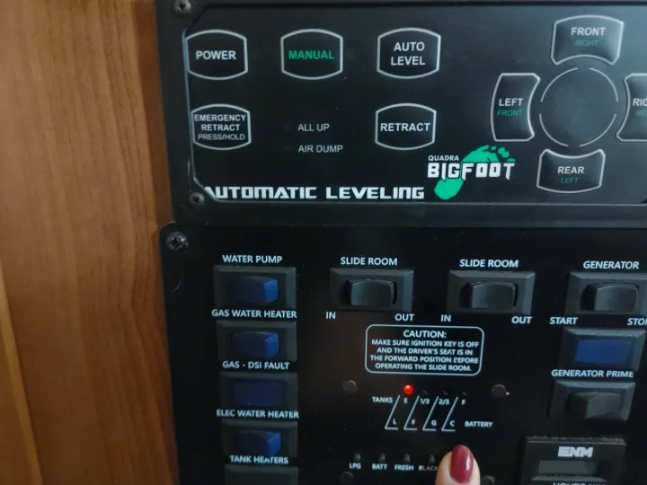 RV rental multi-function control panel: automatic leveling, slide room, water, and generator system buttons.. Other Other 2019