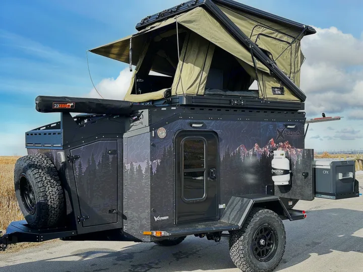 Explore wild landscapes with this Xpedition Trailers Voyager off-road RV rental, featuring a rooftop tent and full overland setup.. Other Other 2024