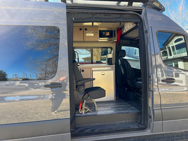 Step inside this RV rental camper van: kitchenette with microwave & fridge, swivel seat, and solar power setup.. Antero Adventure Motors Antero Adventure Motors Class B 2022