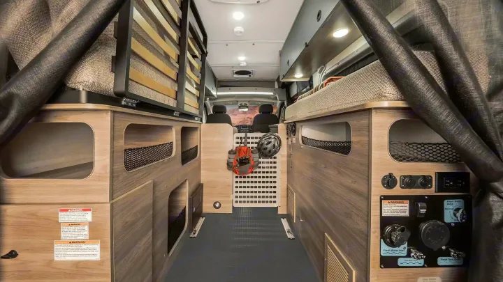 Spacious rv rental interior showing sleeping areas, organized storage, and essential water system controls. Ready for adventure.. Winnebago Solis Pocket 2022