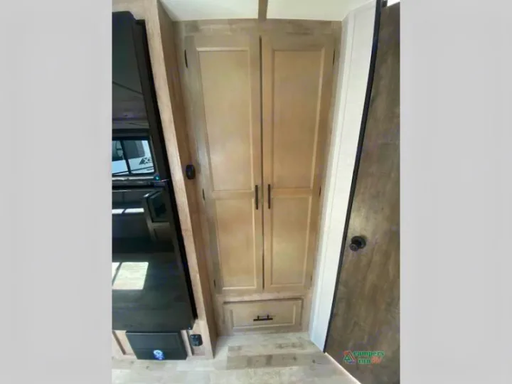 This RV rental offers a tall interior storage cabinet, adjacent dinette seating, and access door. Ideal for campers!. Gulf Stream Friendship 268BH 2024